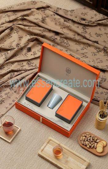 There Are Two Iron Boxes And a Cup In The Gift Box